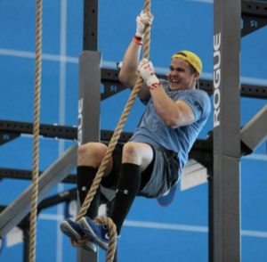 Jon Gibson rope climbing in Nike Frees