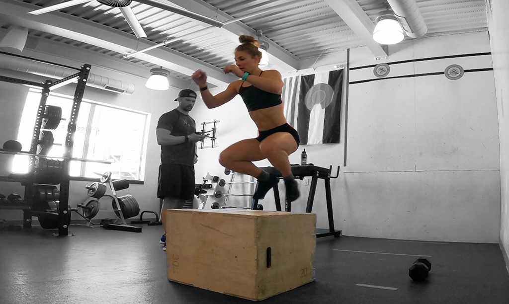 Emily Kramer doing plyo box jumps during CrossFit Open 22.1
